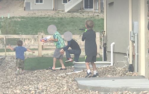 Kids playing in a neighbors window well
